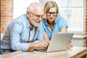 Older couple looking credit report