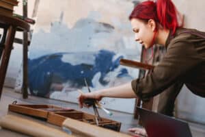 Woman Painting with Art Supplies