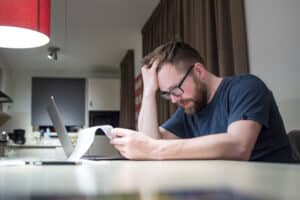 man stressing needing tax resolution services