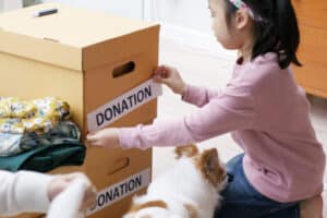 Girl packing donation boxes