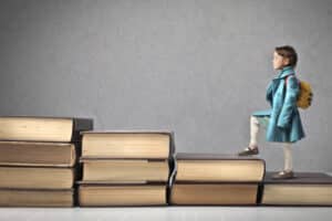 Child walking Up Book stairs